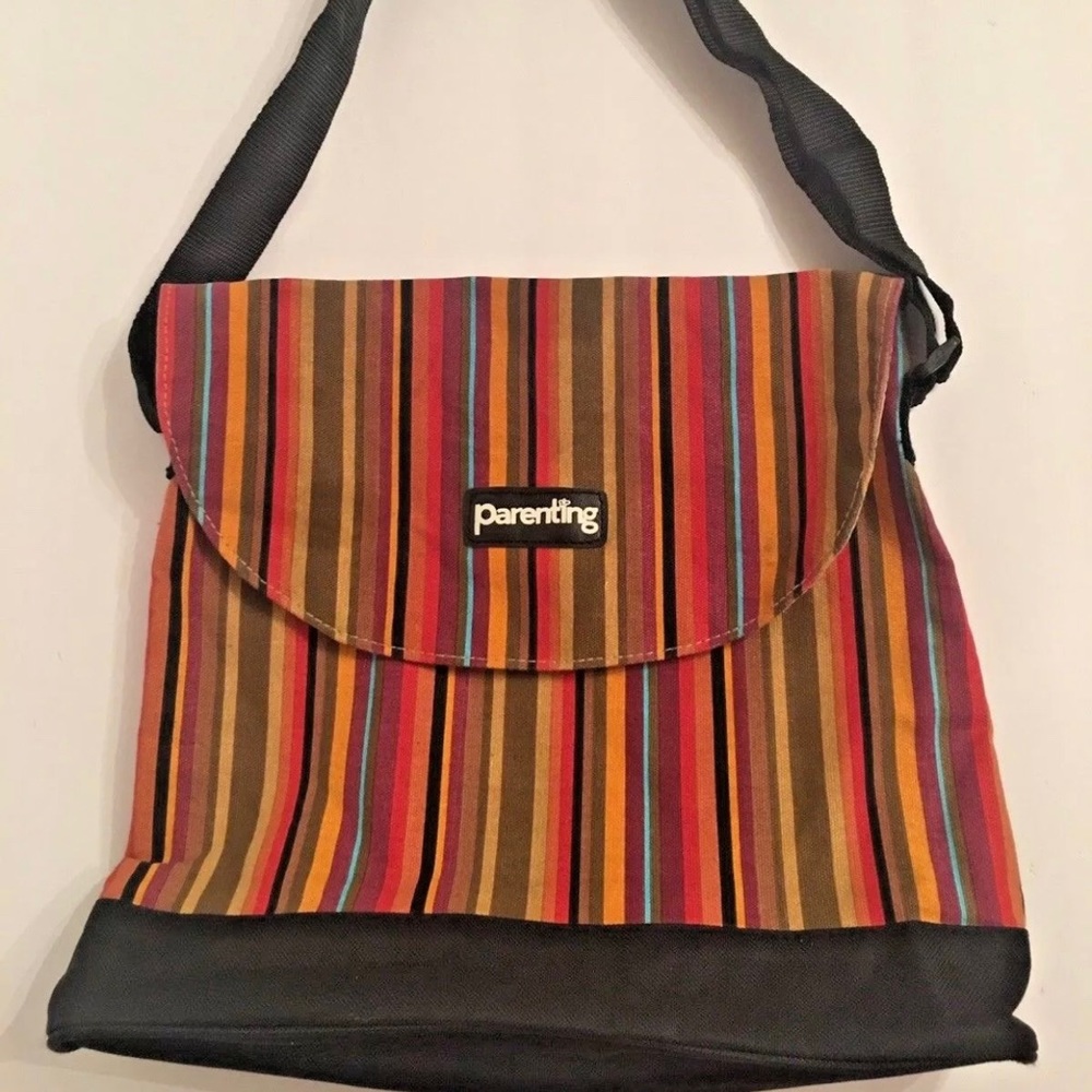 Parenting Bag Colorful Canvass inside is made of “wipeable easy clean” material